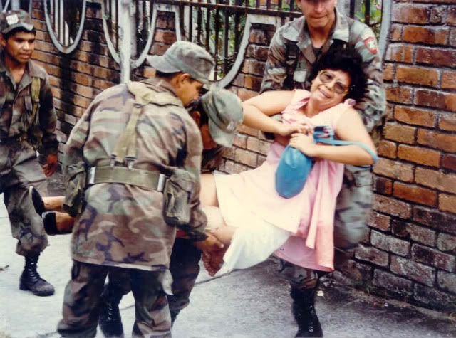 Salvadoran Soldiers evacuate a wounded civilian, Colonia Universitaria Norte, San Salvador, Nov, 1989. Photo: Robert Meacham photo FMLNOffensiveNov121989.jpg