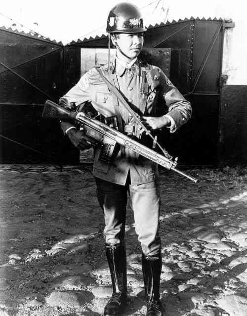 Young operative of the Guardia Nacional stands guard at a coffee mill in Santiago de Maria, Usulutan, El Salvador, Circa 1989. Photo: Robert Meacham photo GNsantiagodeMariaUsulutan.jpg